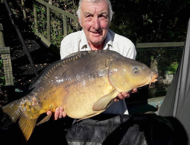 Neil Shipman with a carp from Quarry Bank Fishery, France