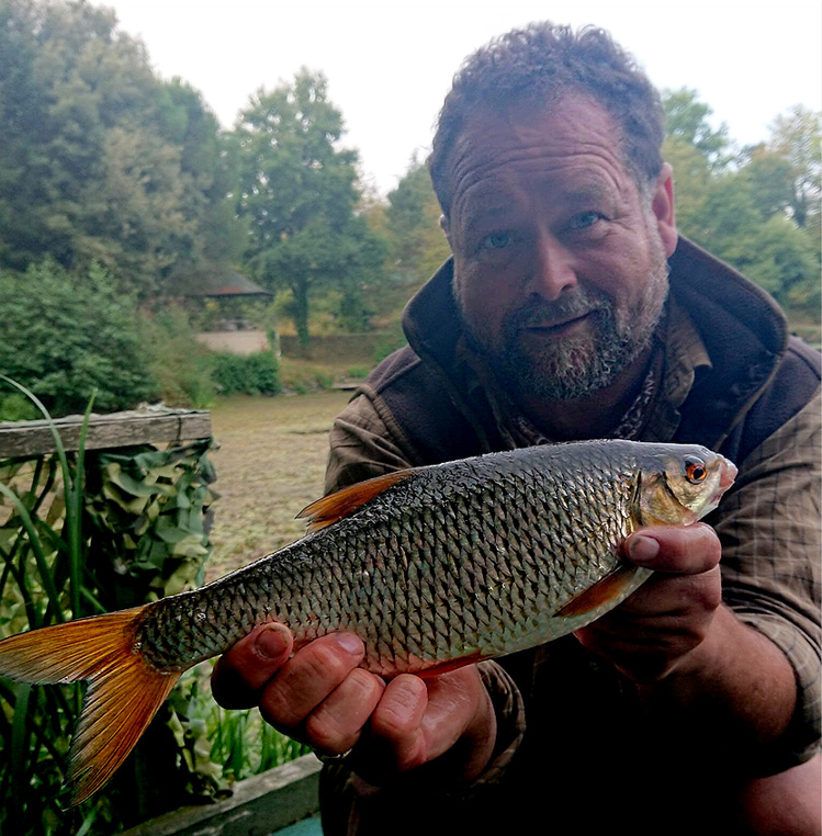 Shaun Harrison with near 2lb roach from Quarry Bank Fishery.